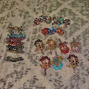 Set of 23 gold and silver hair clips with jewels; various colors and shapes